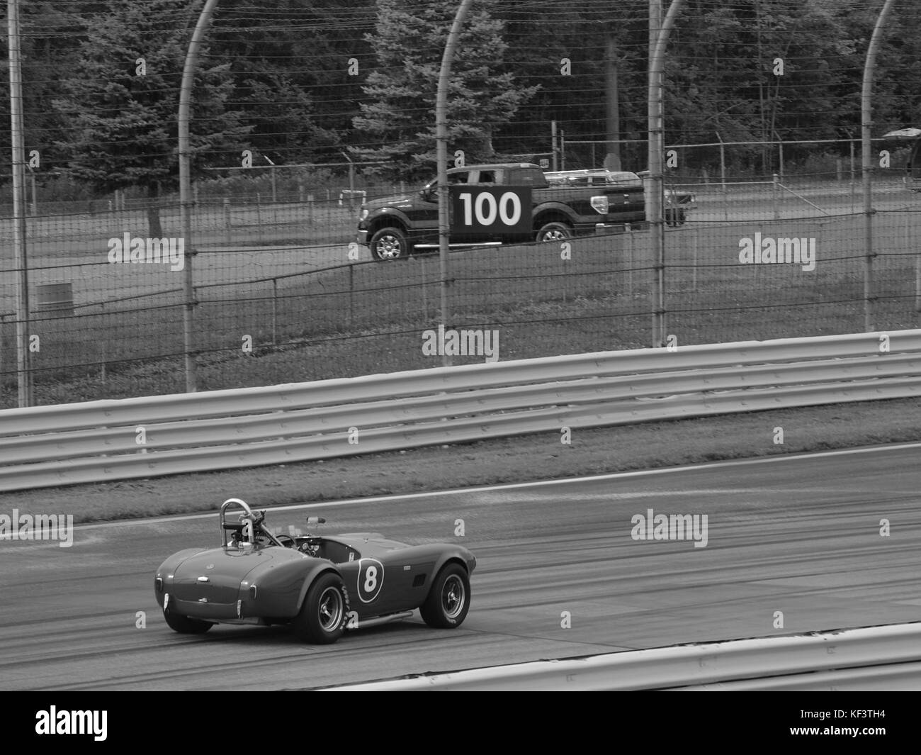 Mike Stotts' 1963 Shelby Cobra entering turn number 1 on the famed Watkins Glen race track near Seneca Lake in the Finger Lakes area of NY State' Stock Photo