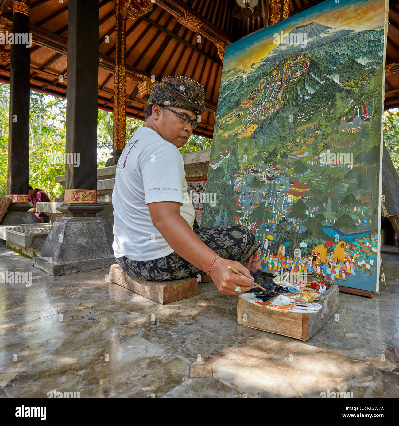 Local artist working at the Agung Rai Museum of Art (ARMA). Ubud, Bali, Indonesia. Stock Photo