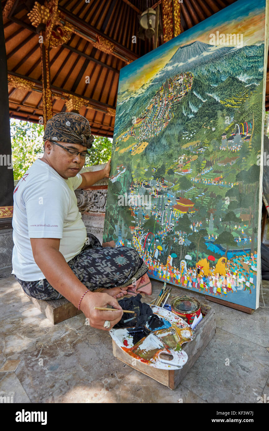 Balinese artist working at the Agung Rai Museum of Art (ARMA). Ubud, Bali, Indonesia. Stock Photo