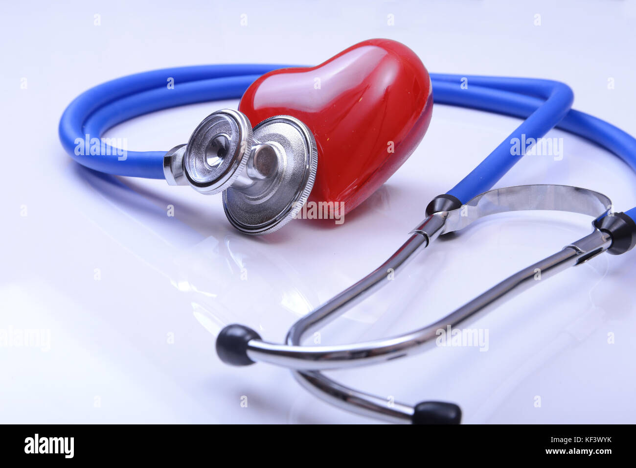 Red heart and a stethoscope on white background Stock Photo - Alamy