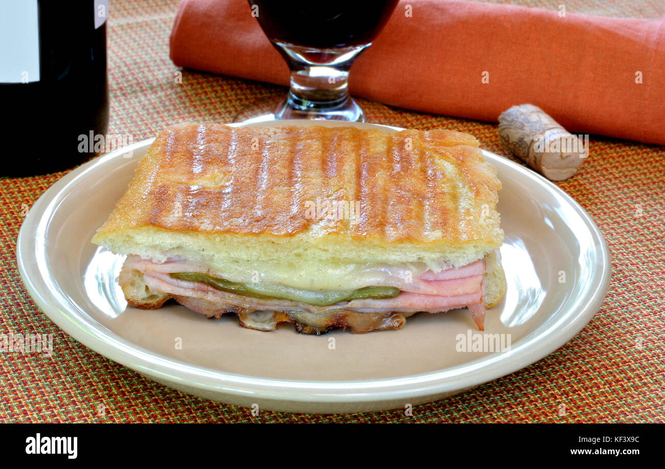 Panini sandwich with melted provolone cheese, roasted peppers and ham