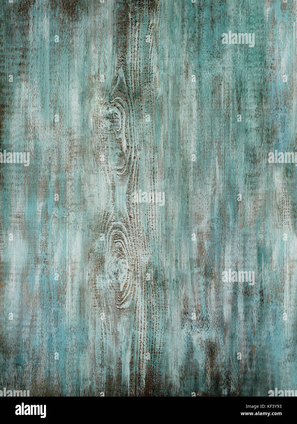 Distressed and weathered painted turquoise wood surface showing scuffs