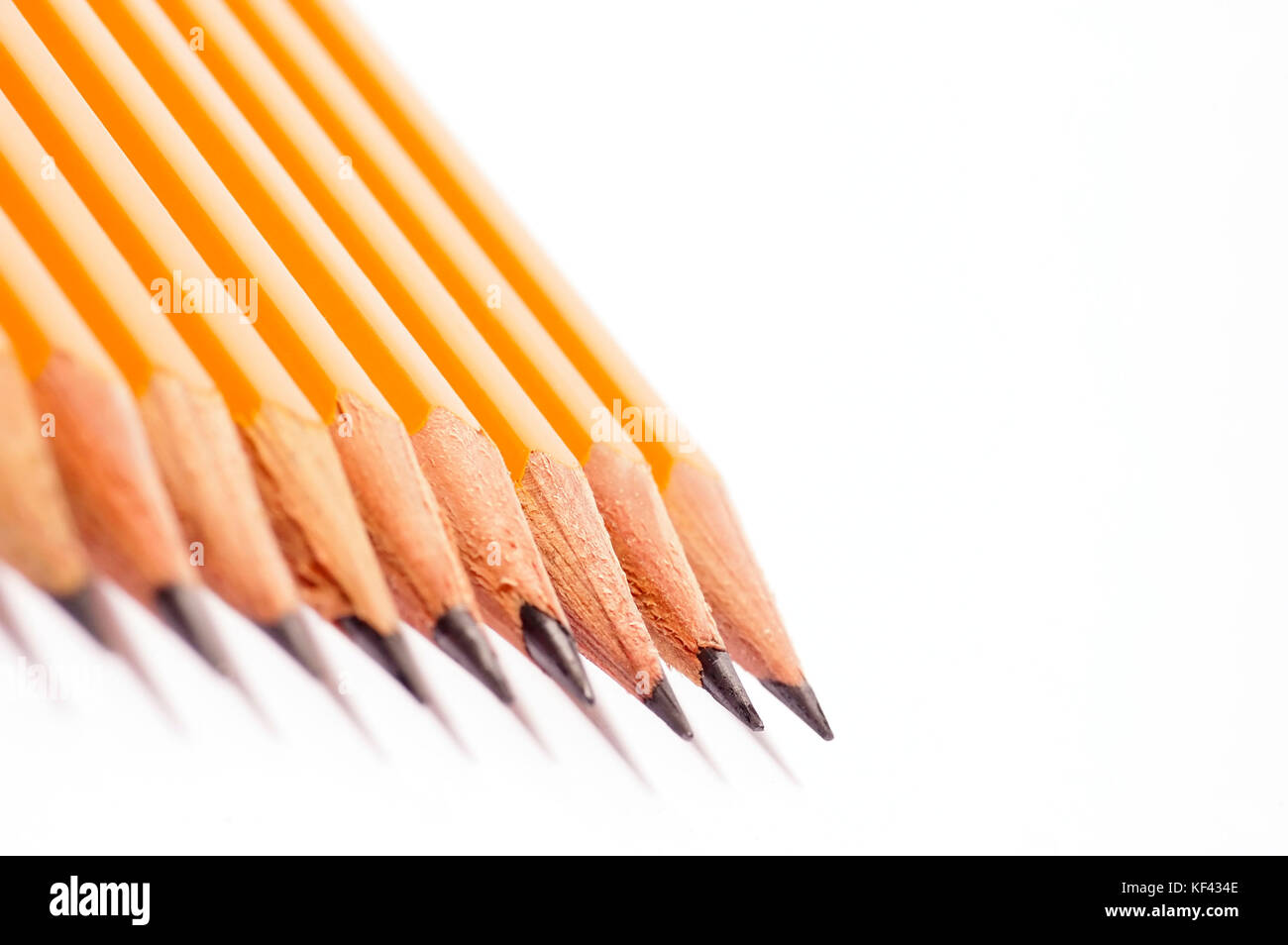 row of yellow drawing pencils isolated Stock Photo