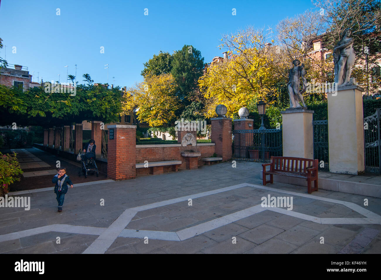 Venice, Italy. October, 2017. People walk in the garden of Ca Rezzonico where the trees and the plants are changing foliage in Venice, Italy. © Simone Stock Photo