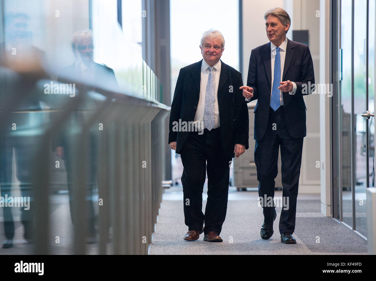 Chancellor Philip Hammond (right) walks with Director of The Francis Crick Institute, Paul Nurse, during his visit to the institute, in London, as the UK economy unexpectedly accelerated in the third quarter, upping the pressure on the Bank of England to hike interest rates next month. Stock Photo