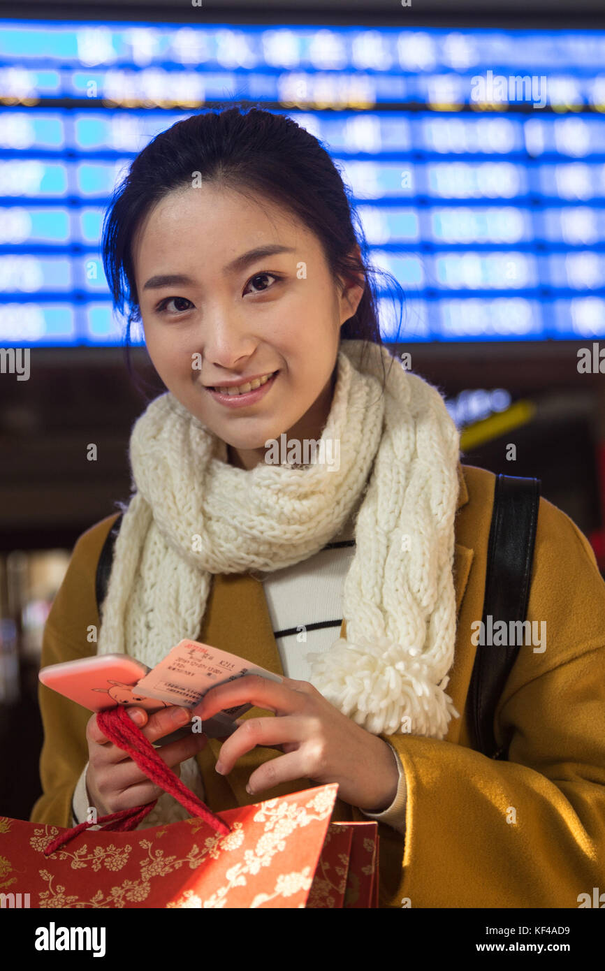Young women at the railway station Stock Photo - Alamy