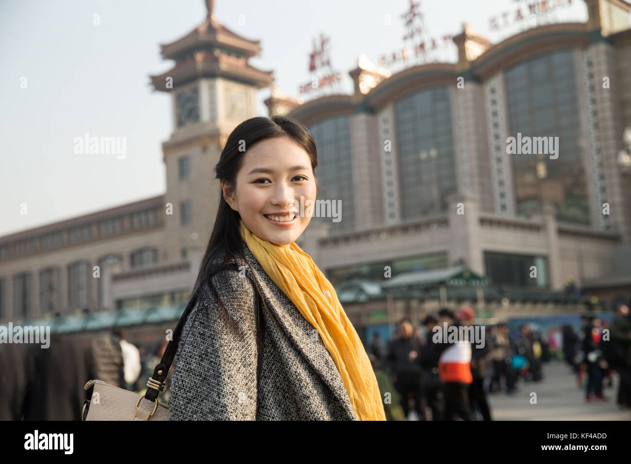 Young women at the railway station Stock Photo - Alamy