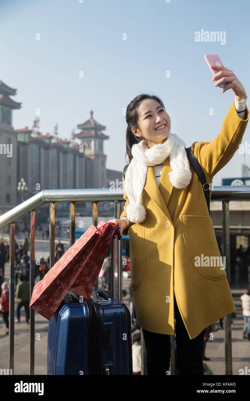 Young women at the railway station Stock Photo - Alamy
