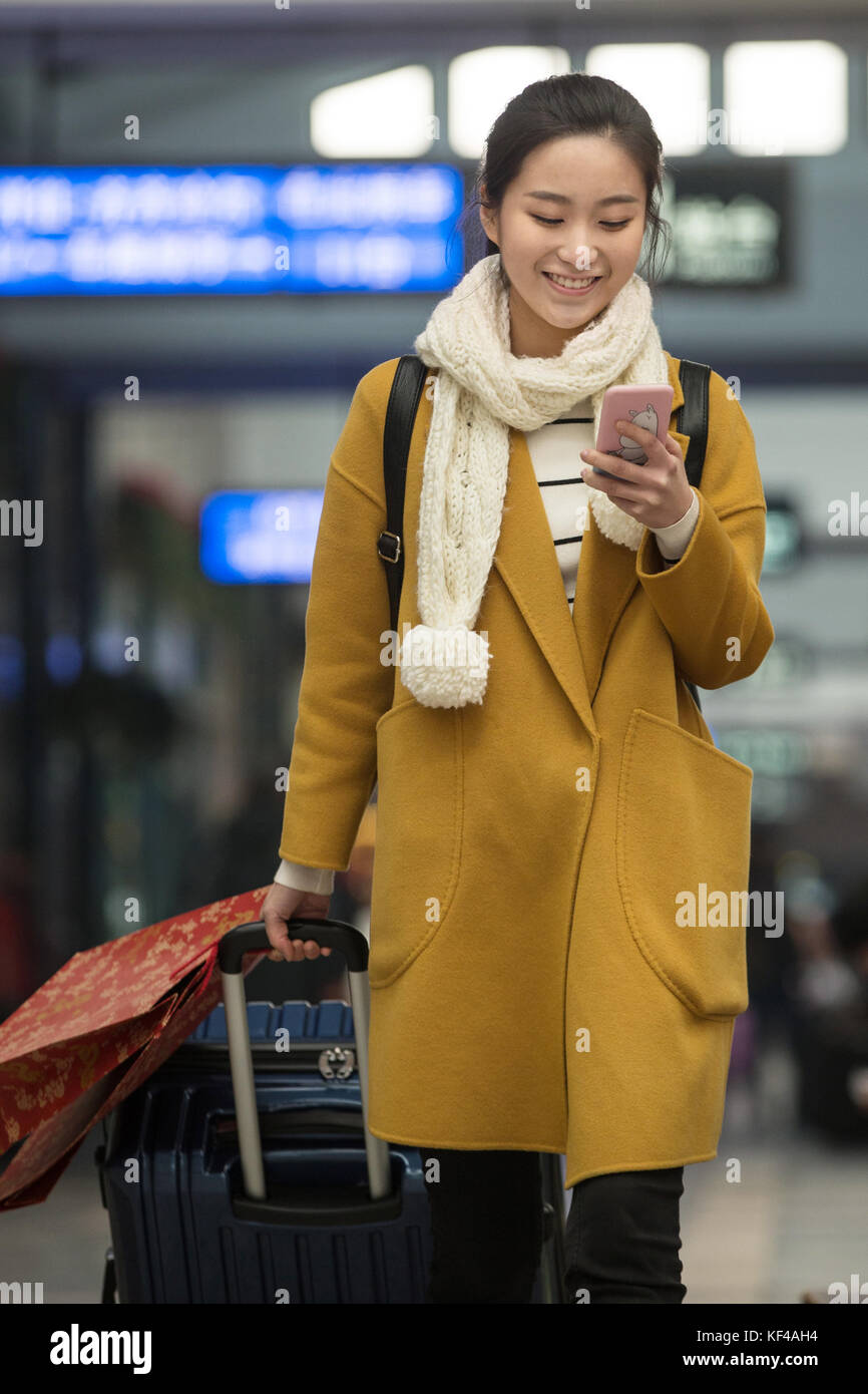 Young women at the railway station Stock Photo - Alamy
