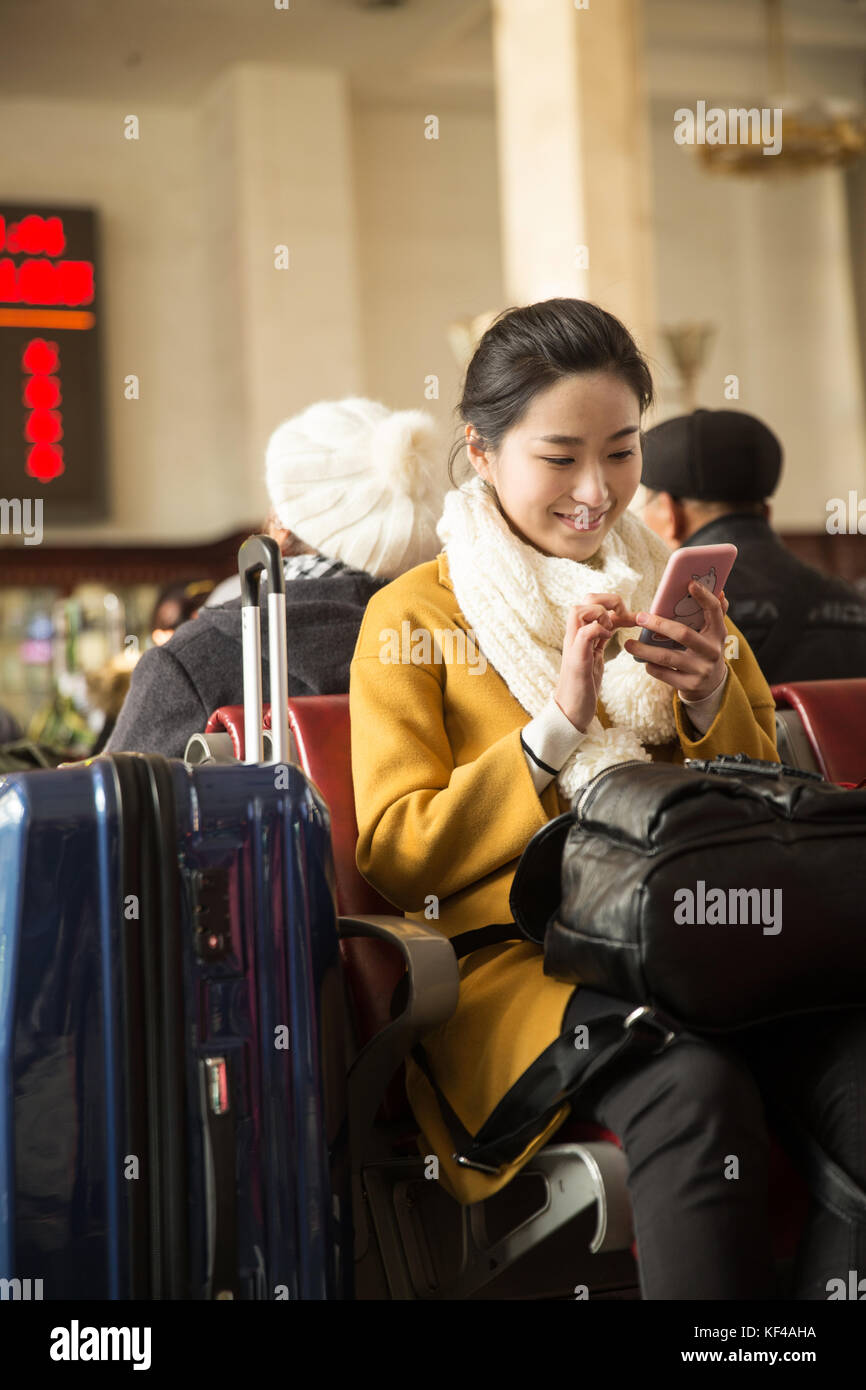Young women at the railway station Stock Photo - Alamy