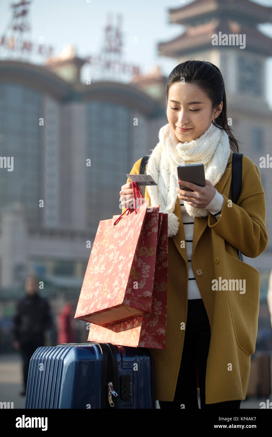 Young women at the railway station Stock Photo - Alamy
