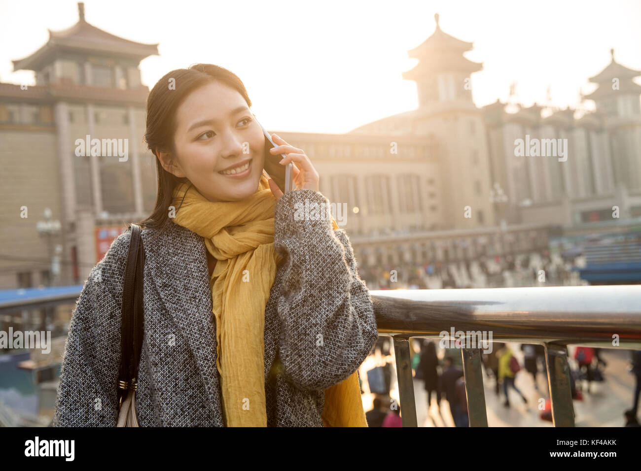 Young women at the railway station Stock Photo - Alamy