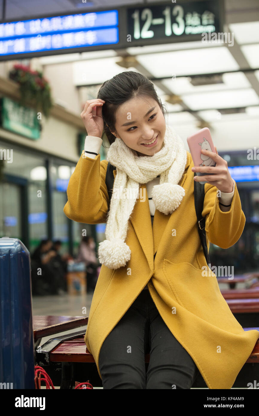 Young women at the railway station Stock Photo - Alamy