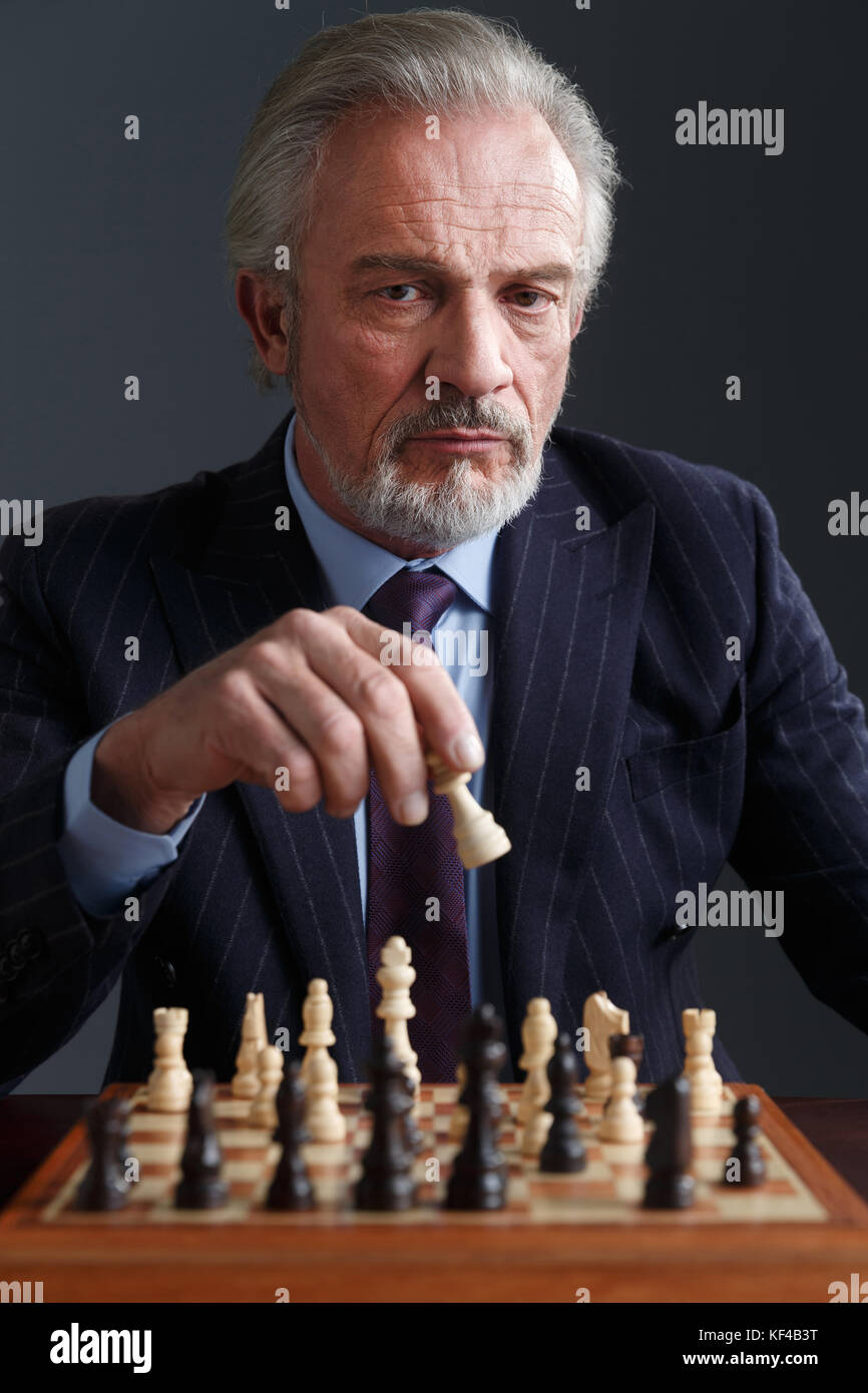 Photo of Mature Cheerful Man Friendly Play Chess Free-time Competition  Isolated Over Purple Color Background Stock Image - Image of fashion,  match: 249617899