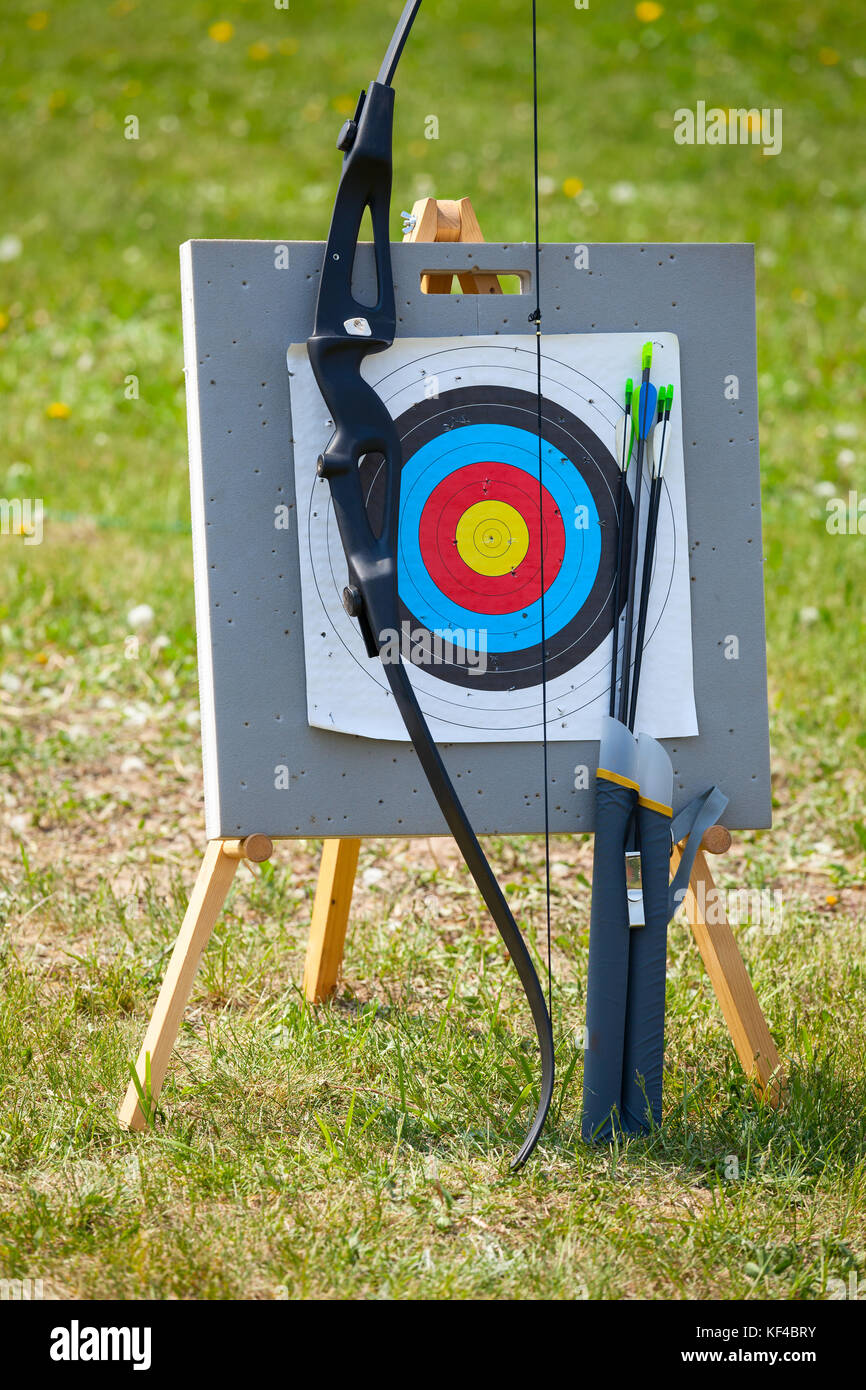 Bow and arrows with archery target outdoors Stock Photo Alamy