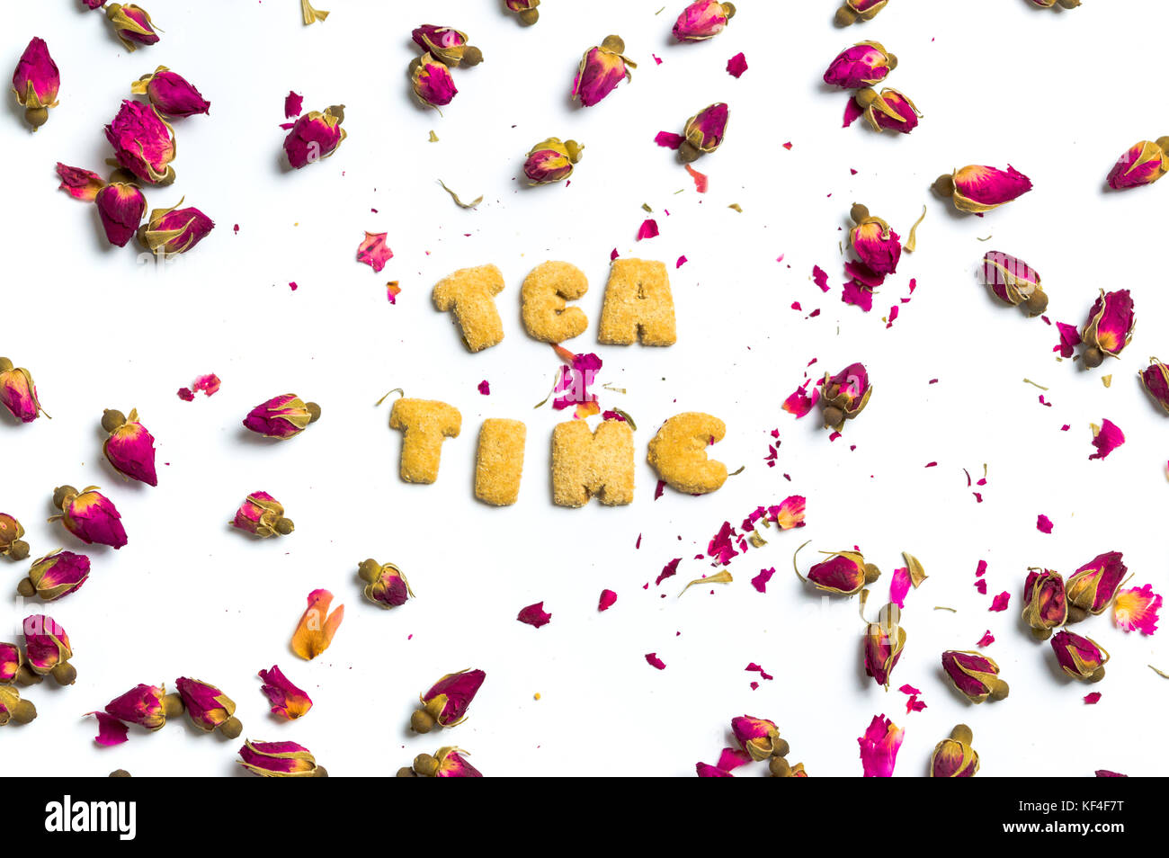 Tea time note and rose tea flowers on white background Stock Photo