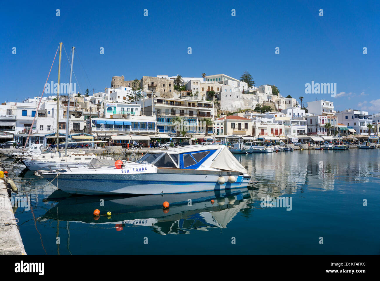 Motor bats and sailing boats at the harbour of Naxos-town, Naxos, Cyclades, Aegean, Greece Stock Photo
