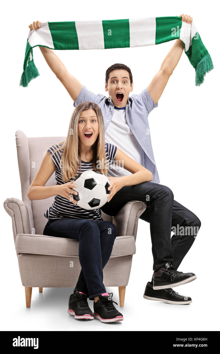 Excited football fans sitting in an armchair and cheering isolated on ...