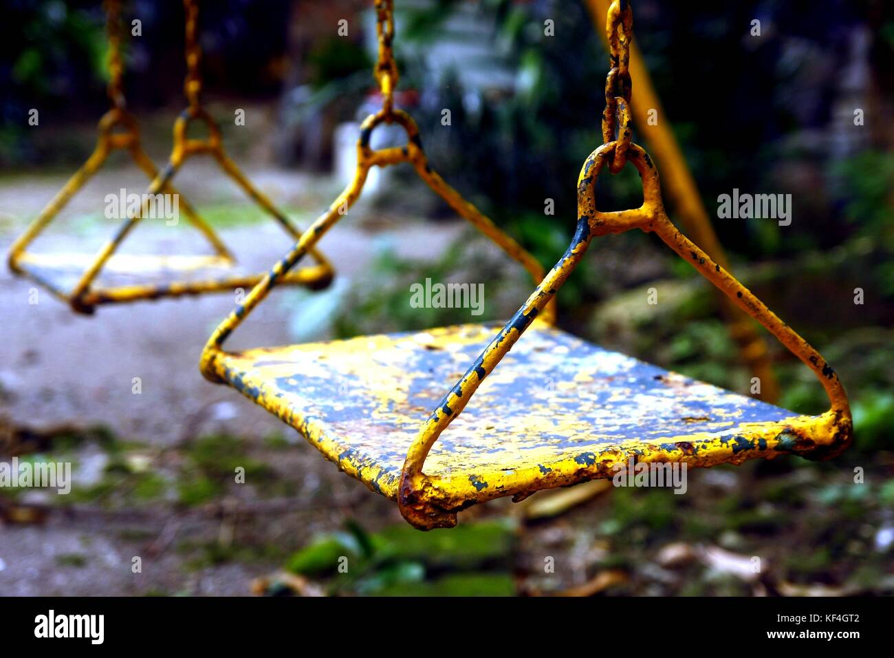 Photo of rusty swing seat in a playground Stock Photo