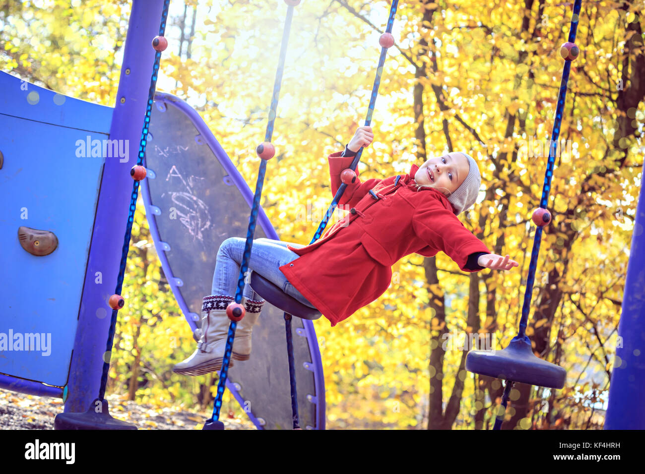 little girl playing on playground in the park Stock Photo Alamy