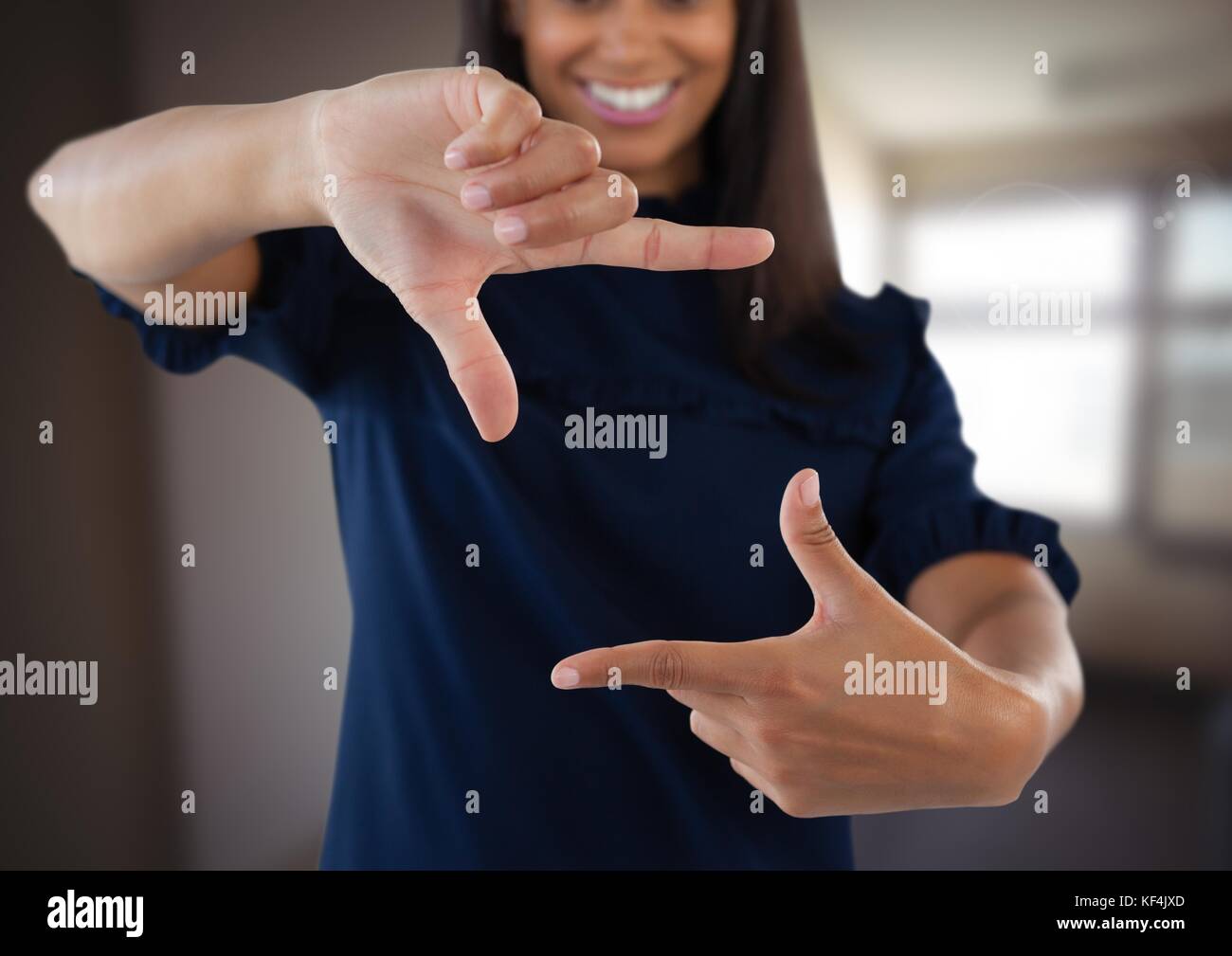 Digital composite of Businesswoman making invisible shape with hands in ...