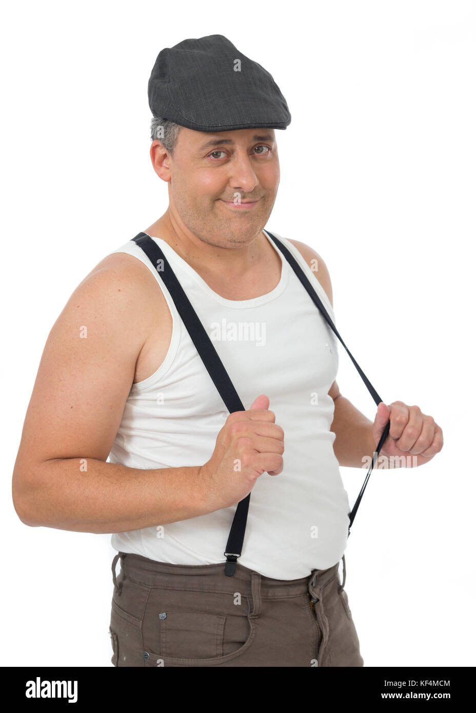 Fat man holds the pants suspender. He is smiling. Vintage and retro. Clothes of old. The old fashion. Isolated on white background. Stock Photo