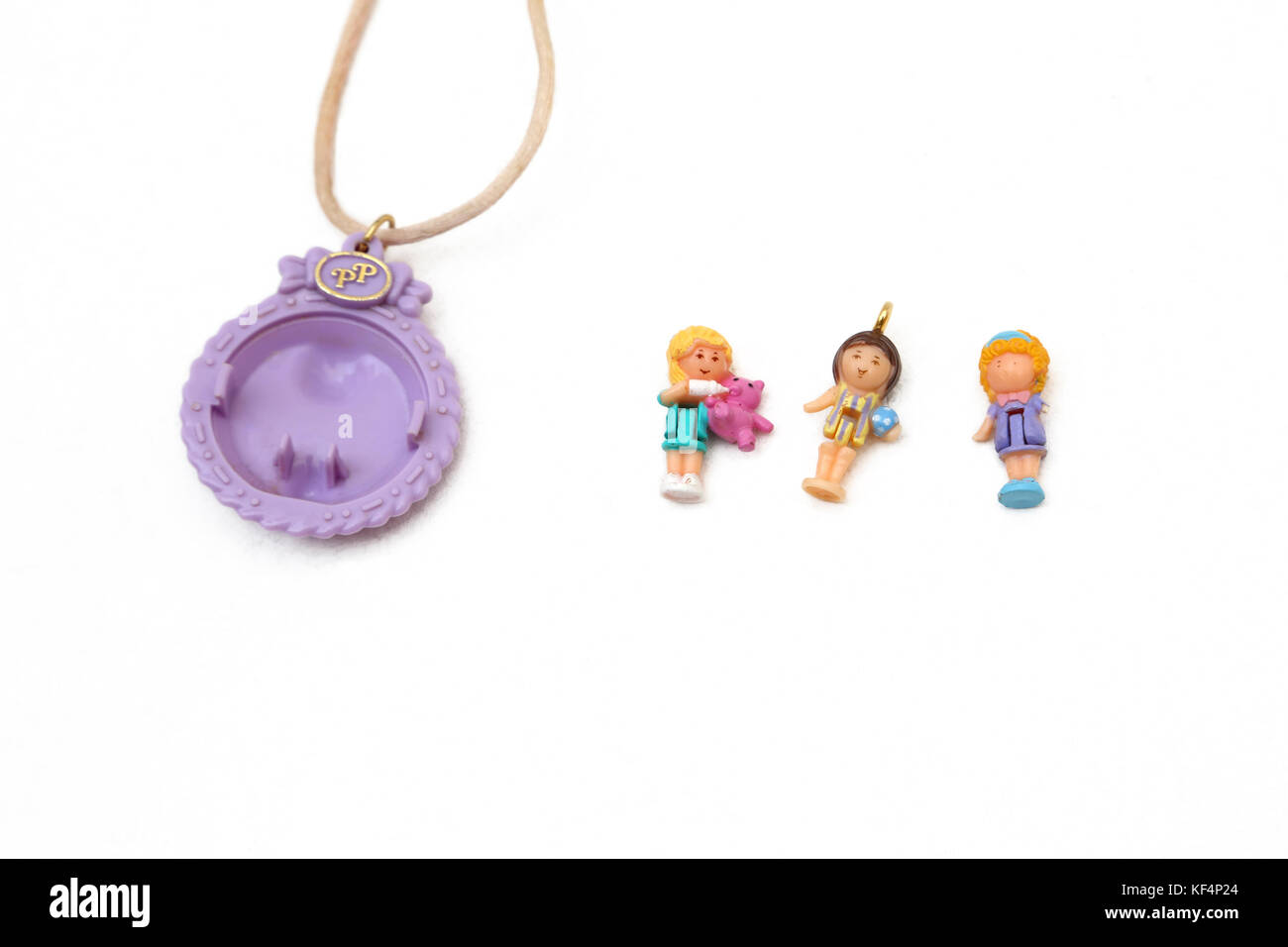 Vintage 1990's Toys Polly Pocket Dolls and necklace Stock Photo - Alamy