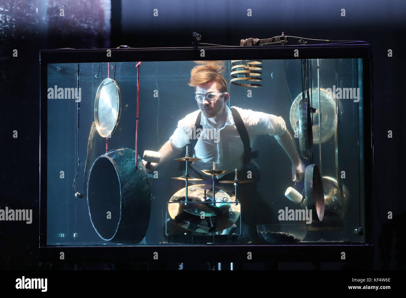 Percussionist Morten Poulsen, a musician with Danish company Between Music, plays underwater in a tank during a rehearsal ahead of their UK premiere concert Aquasonic at the Tramway in Glasgow. Stock Photo