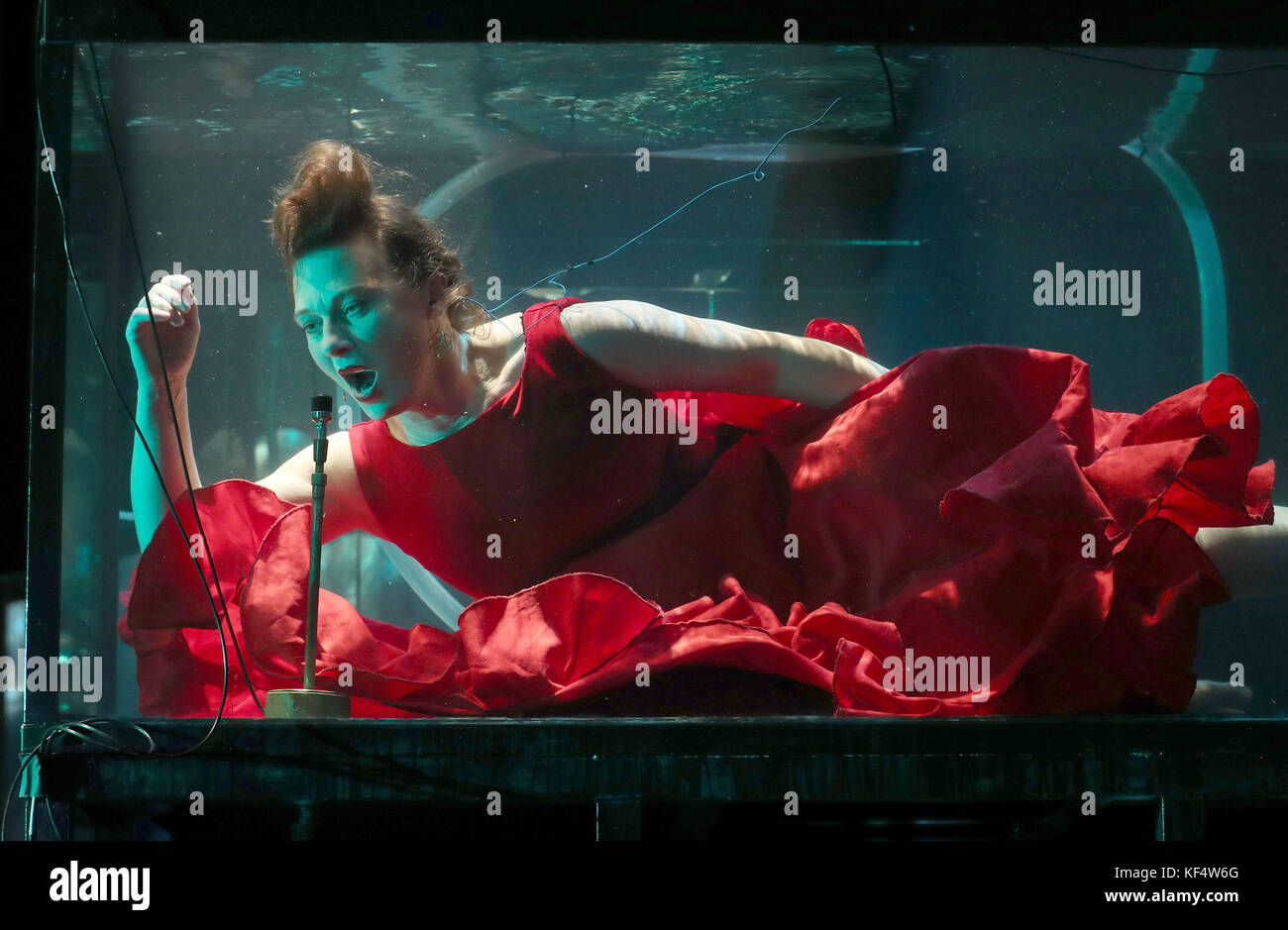 Vocalist Laila Skovmand, a musician with Danish company Between Music, plays underwater in a tank during a rehearsal ahead of their UK premiere concert Aquasonic at the Tramway in Glasgow. Stock Photo