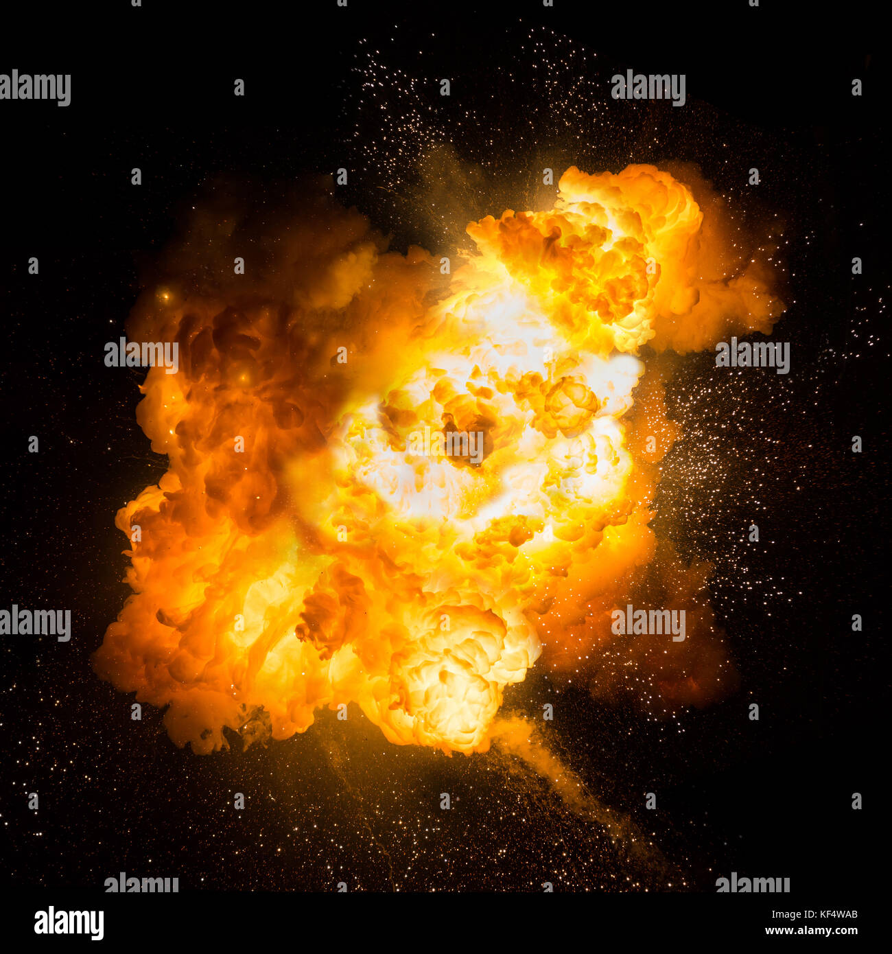 Realistic fiery explosion with sparks over a black background. Fireball detonation Stock Photo