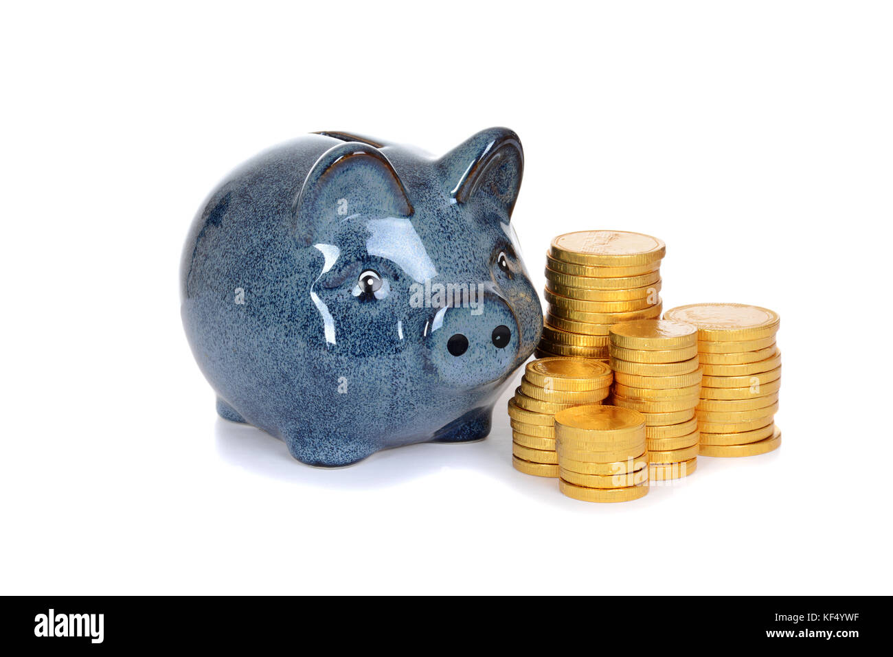blue piggy bank with gold coins Stock Photo