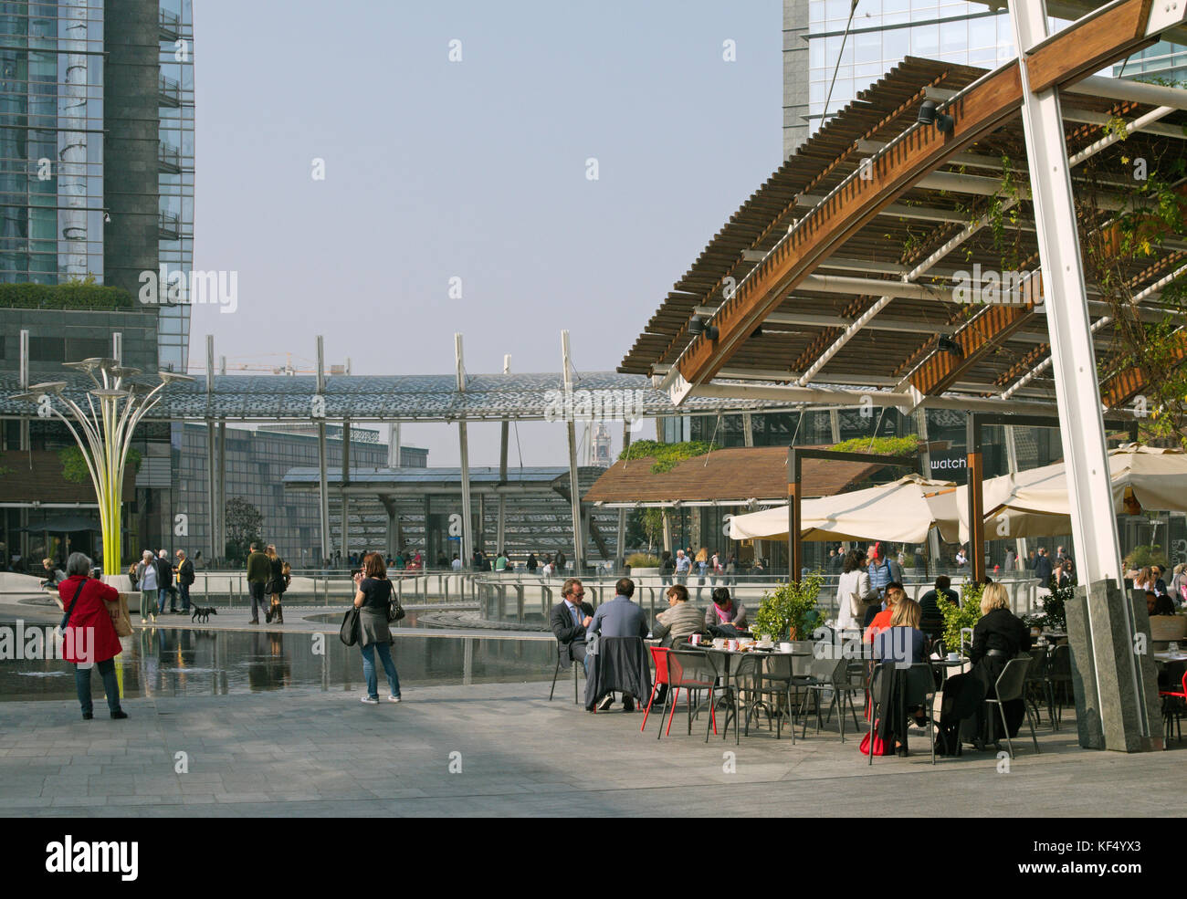 outdoor bar restaurant in Gae Aulenti square in the Porta Nuova business district, Milan, Italy Stock Photo