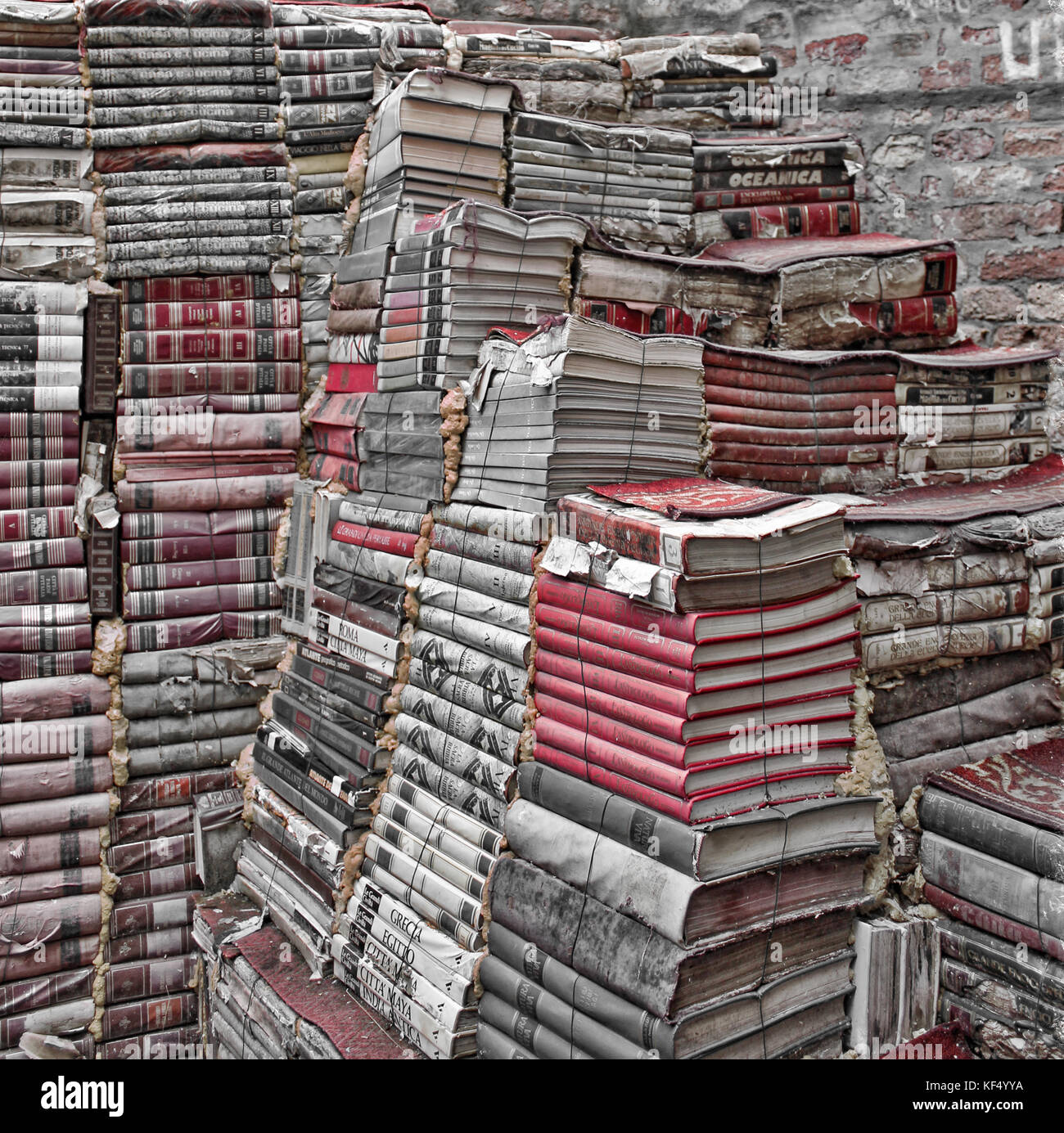 Books piled high. Famous book shop the Acqua Alta, Venice, Italy. Stock Photo