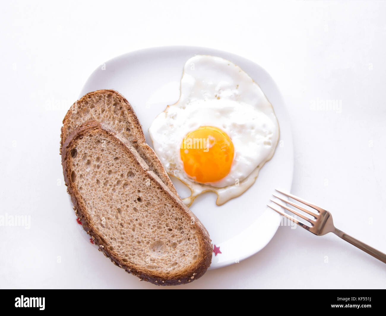 only-one-egg-and-two-slices-of-bread-on-a-white-plate-stock-photo-alamy