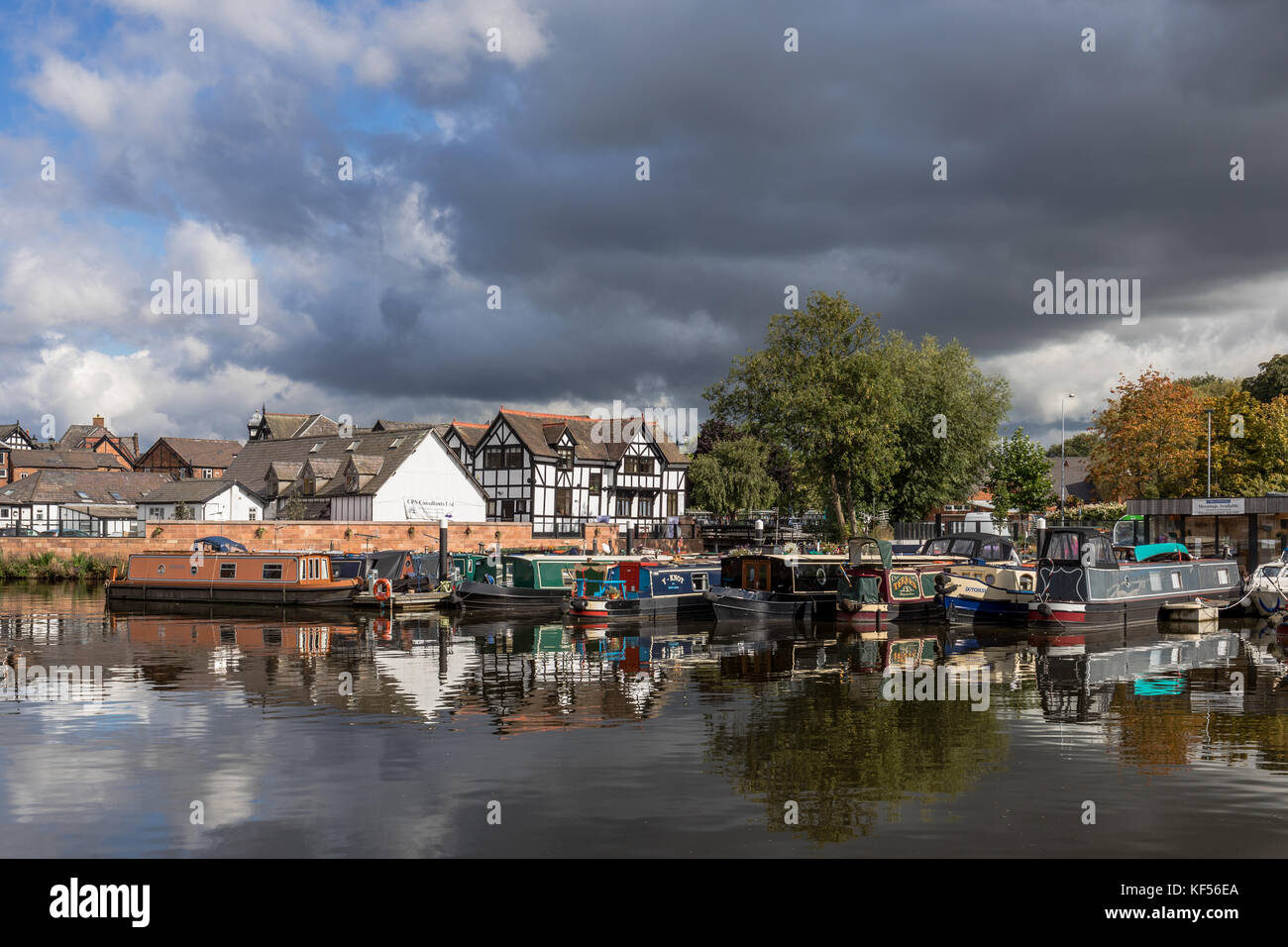 Narrowboats moored along the river Weaver in Northwich, Cheshire, UK