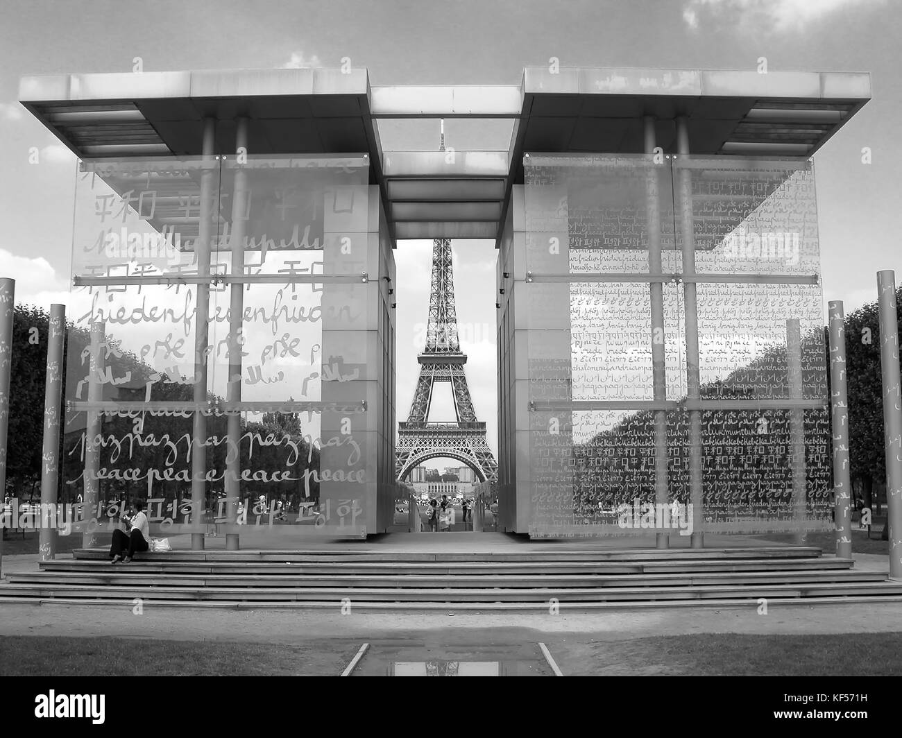 The Peace Wall (Mur de la Paix) in Parc du Champ de Mars, Paris, France, frames the Eiffel Tower: the word 'Peace' is inscribed in 49 languages Stock Photo
