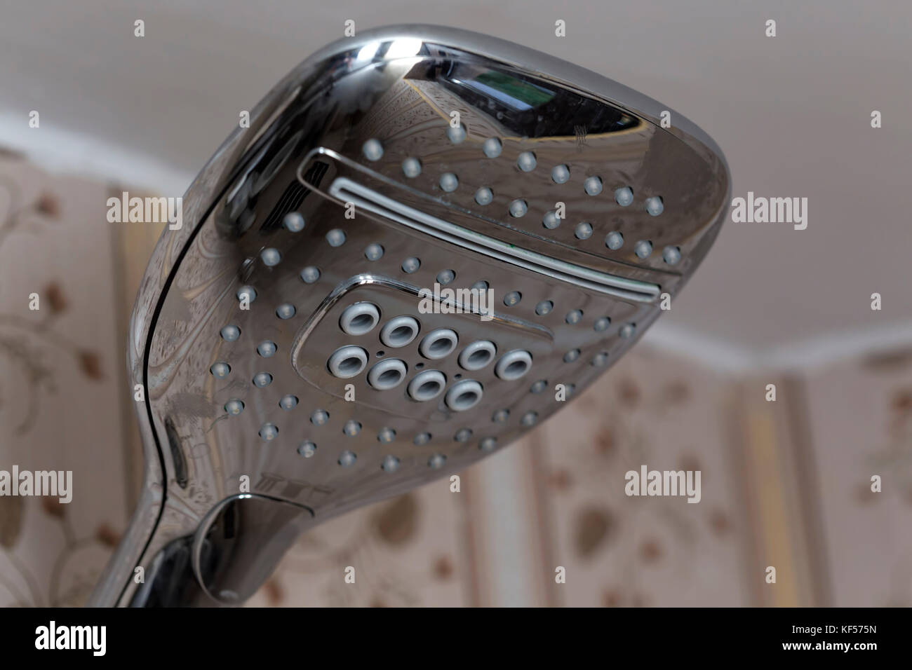 Closed shower head in a hotel bathroom Stock Photo