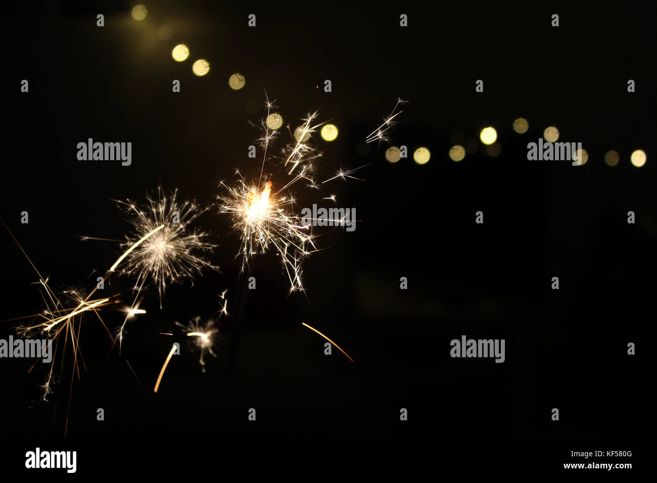 Sparkler lights during New Year's Eve Stock Photo