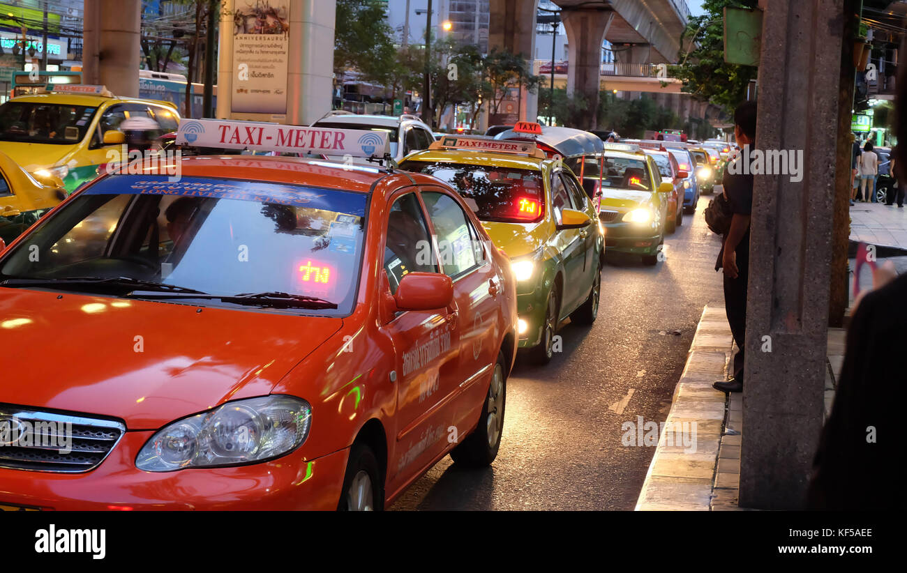 Taxi line up under the sky train during traffic jam in Bangkok. Stock Photo