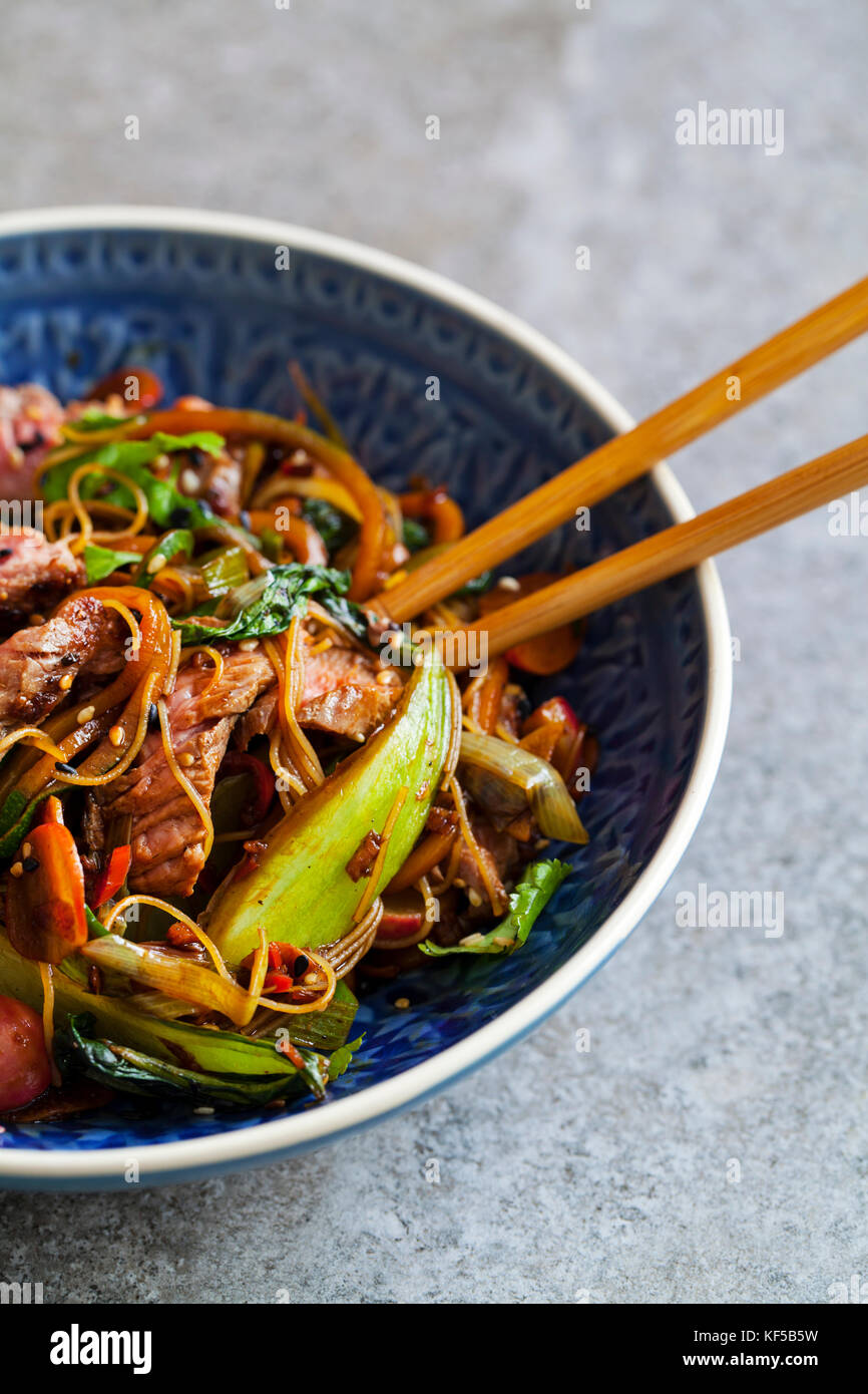 Beef fillet stir fry with courgette, radishes, bok choi and rice