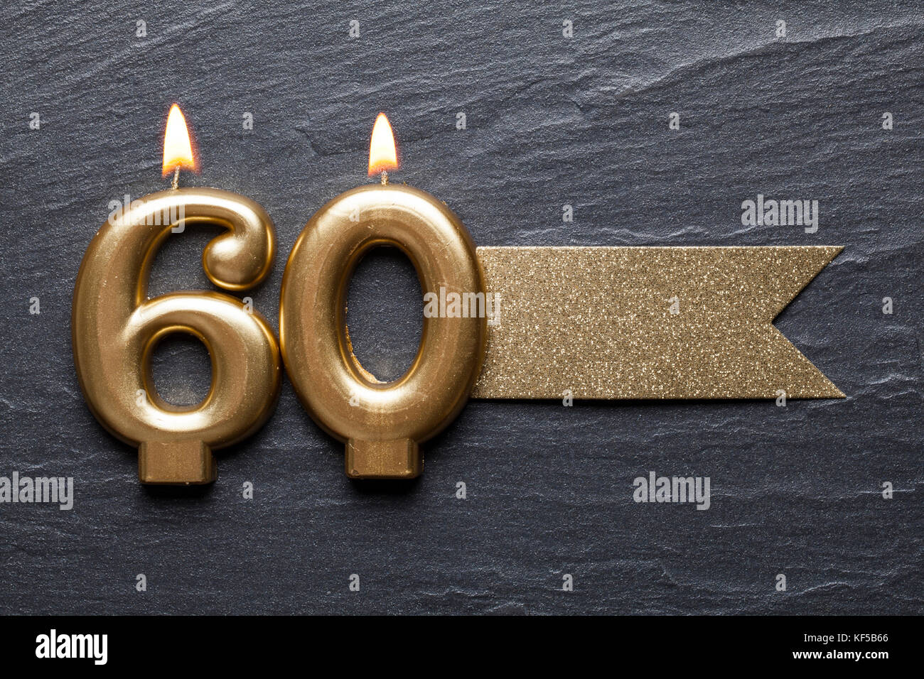 Gold number 60 celebration candle with glitter label Stock Photo Alamy