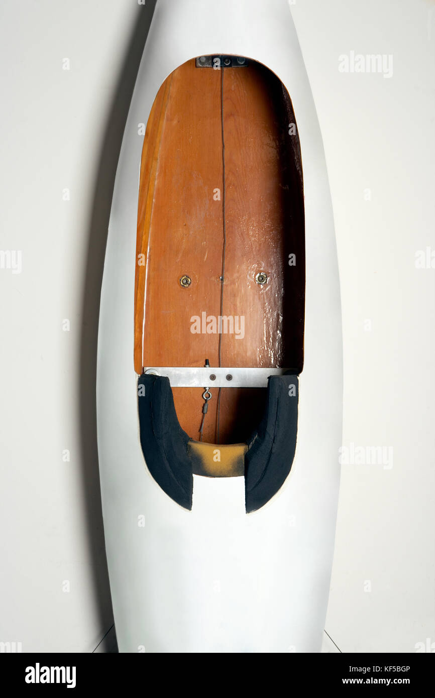 Empty white Soap Box Derby racer viewed from above looking down onto the wooden floor and aerodynamic design Stock Photo