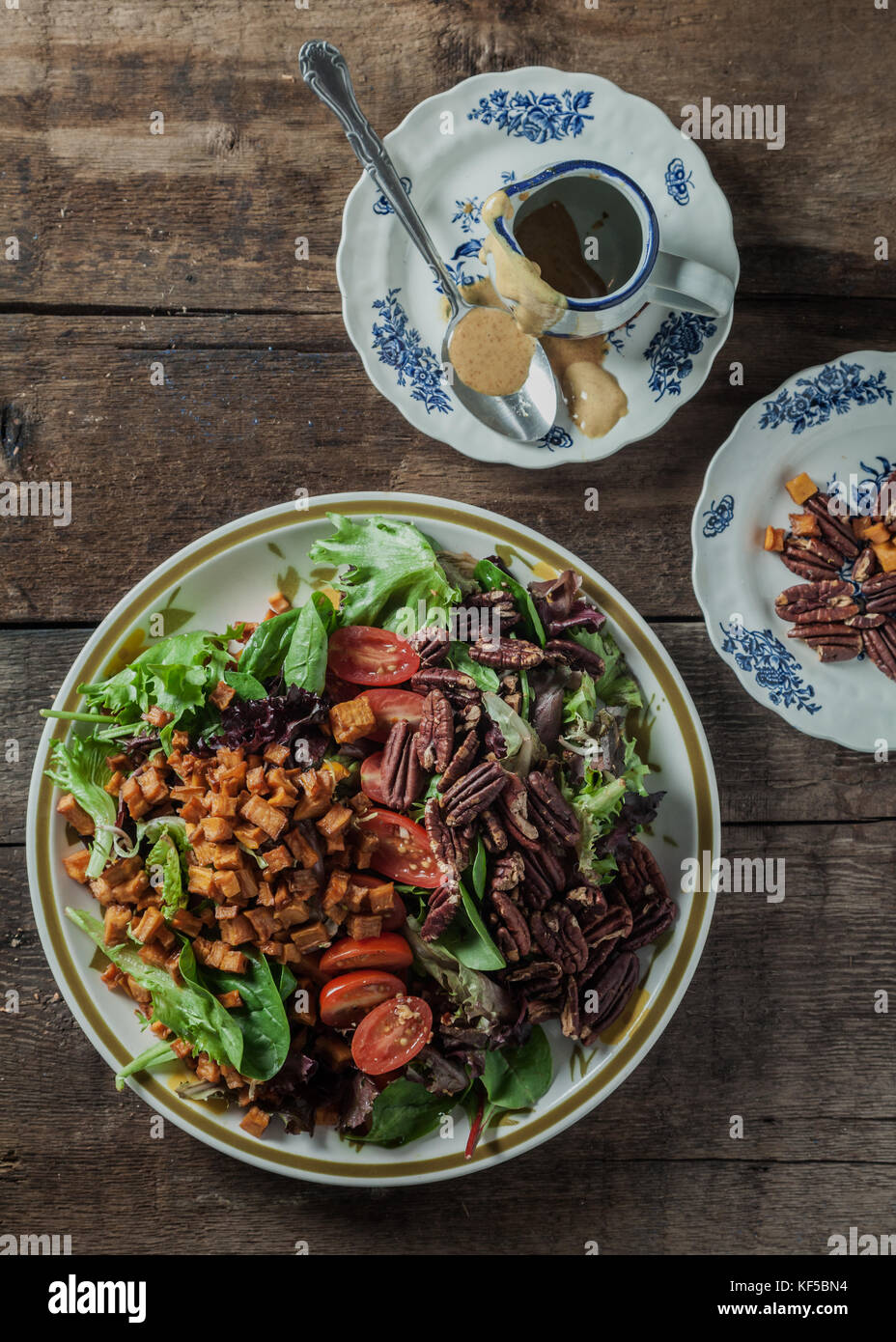 Mesclun salad with roasted sweet potatoes, toasted pecans, tomatoes and