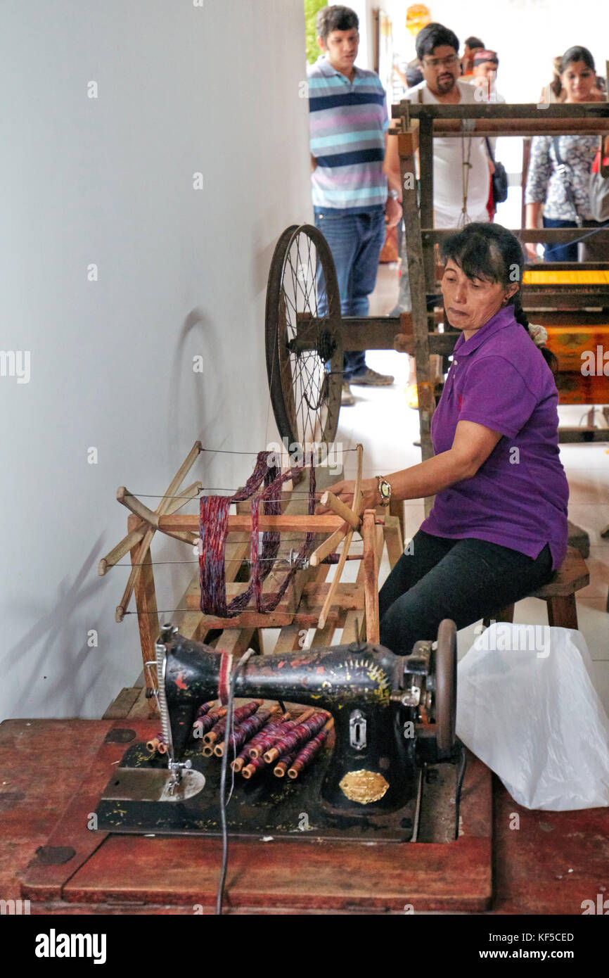 Woman working at batik factory. Batubulan village, Ubud area, Bali, Indonesia. Stock Photo