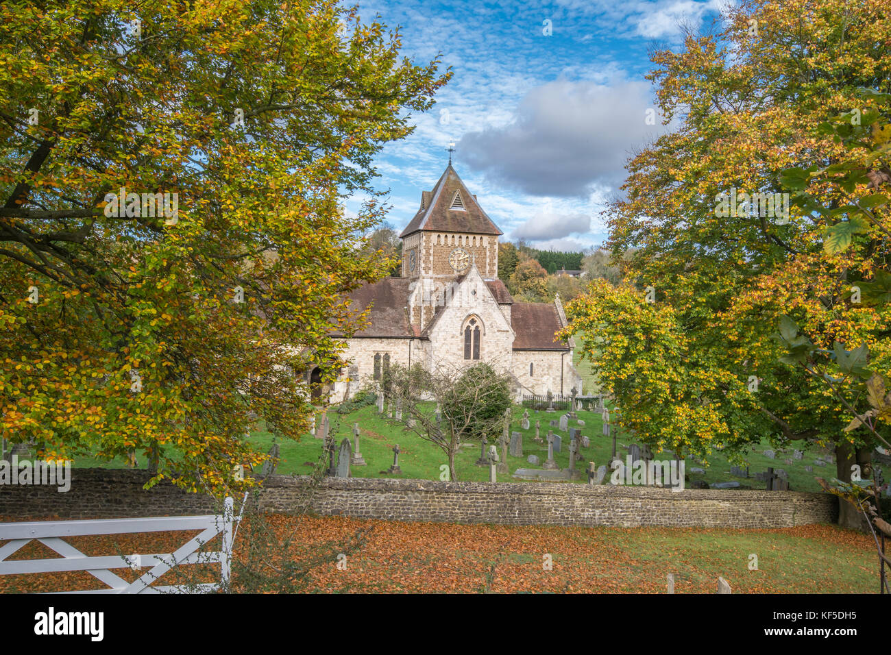 St Laurence Church in Seale village, Surrey, UK, during autumn on a sunny day. Beautiful countryside in the Surrey Hills AONB. Stock Photo