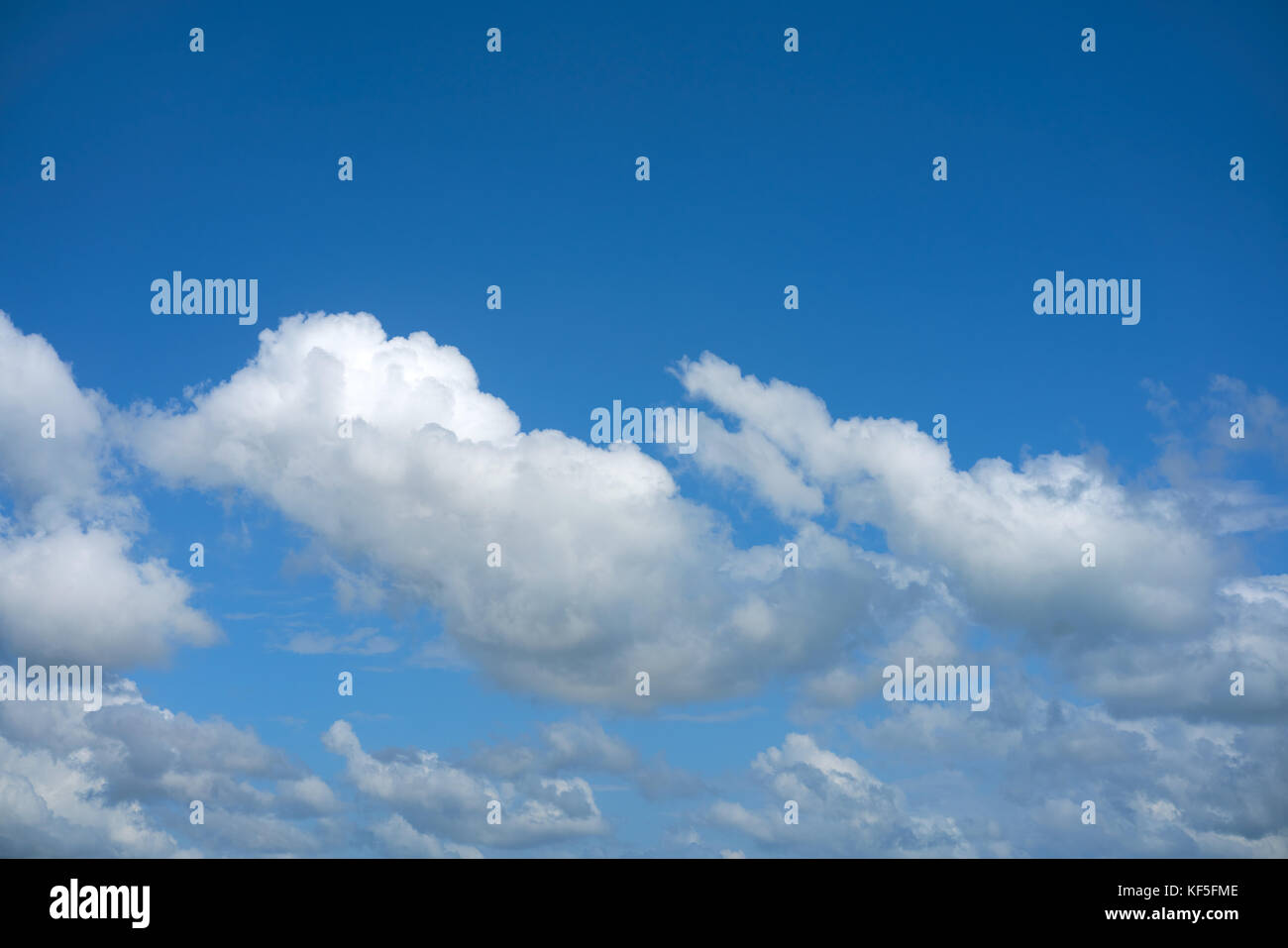 Blue summer sky white cumulus clouds background Stock Photo - Alamy