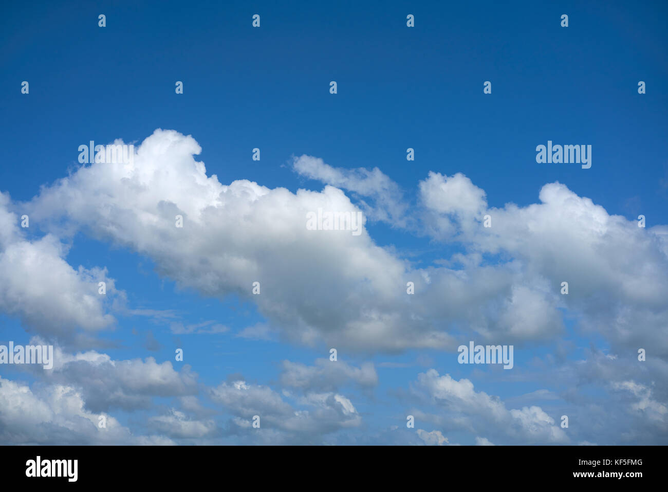 Blue summer sky white cumulus clouds background Stock Photo - Alamy