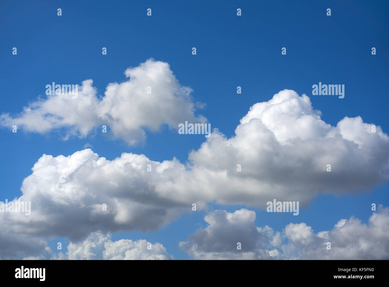 Blue summer sky white cumulus clouds background Stock Photo - Alamy