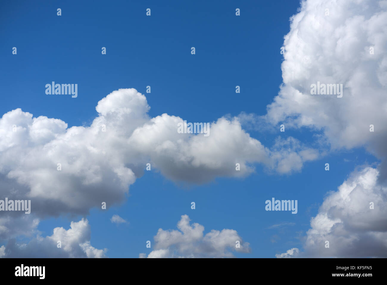 Blue summer sky white cumulus clouds background Stock Photo - Alamy