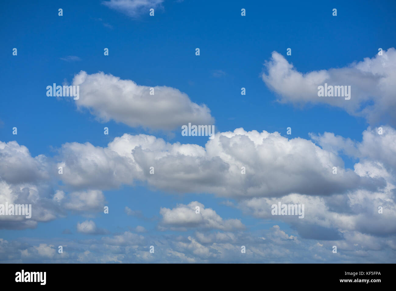 Blue summer sky white cumulus clouds background Stock Photo - Alamy